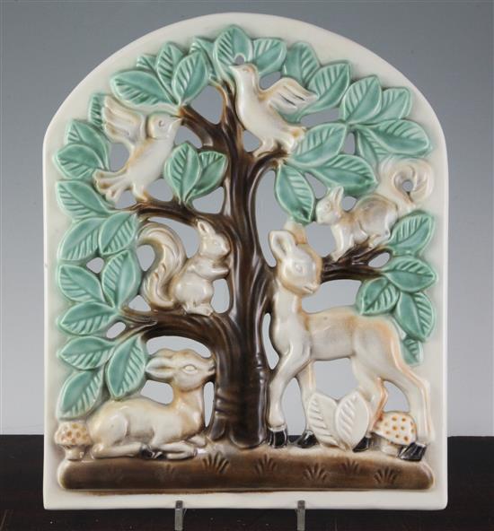 A Poole Pottery Picotee pierced wall plaque designed by Lily ,Markus, slip-cast with a tree with deer, squirrels and birds.